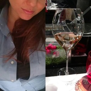 Vegas Massage Escort Rates of Angelica. A top rated pampering experience. Close up of Angelica and wine glass at a high end dinner in Vegas.